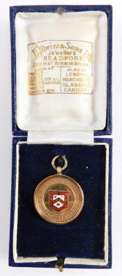 A 9ct gold and enamel cricket medal, centred with a shield and raised W. R. W. Cricket Council John Hoyle Cup, and verso WINNERS 1925 E. HOYLE, 4cm high, 6.9g all in. (cased) - 5