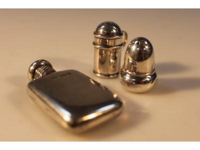 A silver miniature hip flask