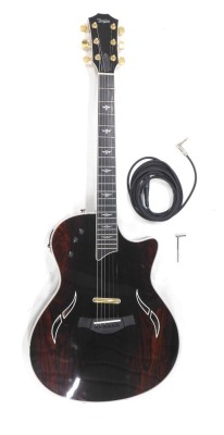 A Taylor T5 Thin Line 5-Way electric guitar, no.20061009512, six string, rosewood finish, 100cm long, cased.