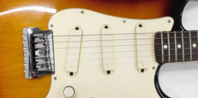 A Fender Stratocaster electric guitar, six string, in cream and vinyl finish, no.323681, 99cm long., cased. - 3