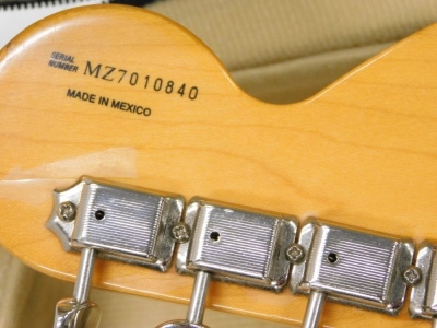 A Fender Stratocaster electric guitar, six string, in cream, no.MZ7010840, 100cm long, cased. - 3