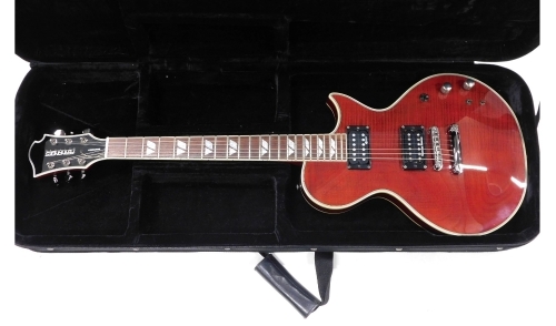 A Fernandes Monterey electric guitar, six string, in wine red, no. FG04031765, 59cm long, in Kinsman case.