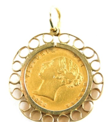 A Victorian half gold sovereign pendant, dated 1861, with scroll design pendant mount and loop, 6.3g.