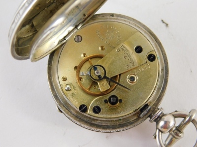 An early 20thC open faced fob watch, with 3cm diameter Roman numeric dial, in engine turned case with vacant cartouche, and a gold plated open faced pocket watch with Roman numeric dial. (2) - 3