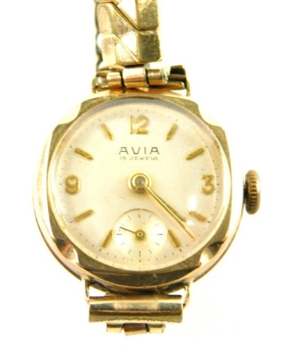 An Avia ladies wristwatch, the 9ct gold circular watch head with seconds dial, on a expanding plated strap, 18g all in.