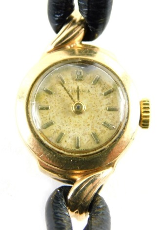 A Rodania 9ct gold cased ladies wristwatch, with small circular watch head, on a black leather strap, the dial 1cm diameter, 9.2g all in.