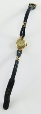 A Rodania 9ct gold cased ladies wristwatch, with small circular watch head, on a black leather strap, the dial 1cm diameter, 9.2g all in. - 2