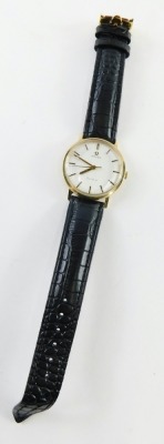 An Omega Geneva gentleman's wristwatch, with a silver coloured dial, in yellow metal case, unmarked, believed to be 9ct gold, 3cm diameter, on a black leather strap, boxed, 33.4g all in. - 2