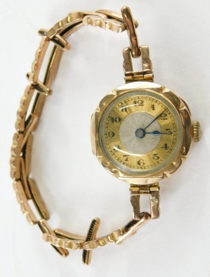 A 9ct gold ladies wristwatch, with a circular watch head with silvered and gold dial with blue hands, on an expanding bracelet, 16.7g all in. - 2