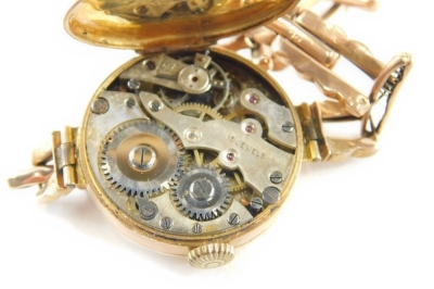 A 9ct gold ladies wristwatch, with a circular watch head with silvered and gold dial with blue hands, on an expanding bracelet, 16.7g all in. - 3