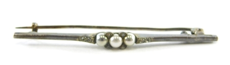 A blister pearl and paste stone set bar brooch, on a white metal band stamped 900, 5.5cm wide, 3g, boxed.