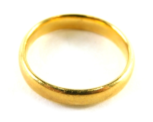 A 22ct gold wedding band, of plain design, ring size J½, 3.6g.