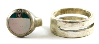 Two silver dress ring, comprising a gentleman's silver signet ring, with tiny diamond, ring size X, and a mother of pearl and green enamel diamond set silver dress ring, ring size O½, 18.6g all in. (2)