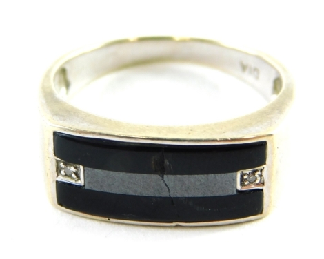 A 9ct white gold gentleman's signet ring, with rectangular bar set with black agate and tiny diamonds, ring size U½, 5.5g all in.