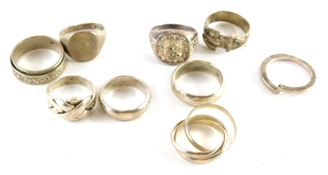 Eight silver and other dress rings, comprising signet rings, puzzle rings, crossover rings, etc., all marked 925, 66.1g all in.