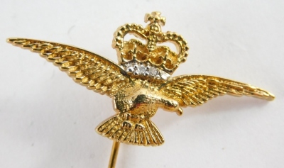 A cap badge of an eagle mounted with crown, set with paste stones, 5cm high, and a pair of gold plated crown cuff links. (2) - 3