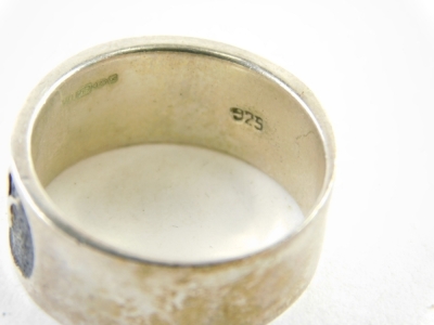 Seven silver and other dress rings, comprising woven design, enamel set wedding bands, etc., all stamped 925, 54.4g all in. - 2