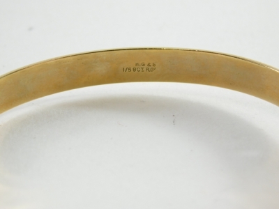 A hinged bangle, with foliate scroll design, marked one 5th 9ct gold metal core, 6cm diameter. - 2