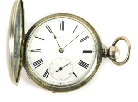 An early 20thC hunter pocket watch, marked Fine Silver, in engine turned case with vacant cartouche, with 6cm Roman numeric dial and subsidiary Arabic second hand, with key wind movement.