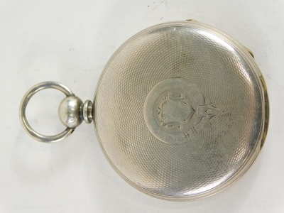 An early 20thC hunter pocket watch, marked Fine Silver, in engine turned case with vacant cartouche, with 6cm Roman numeric dial and subsidiary Arabic second hand, with key wind movement. - 5