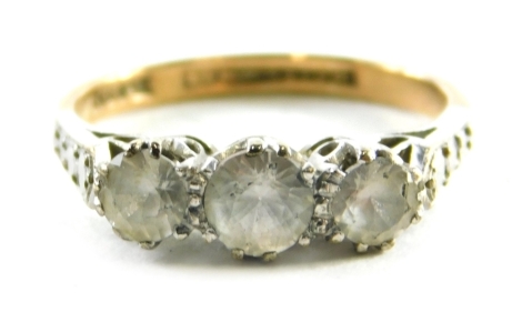 A 9ct gold three stone dress ring, set with three CZ stones, each in a claw setting with white gold shoulders, on a yellow metal band, ring size I½, 2.4g all in.