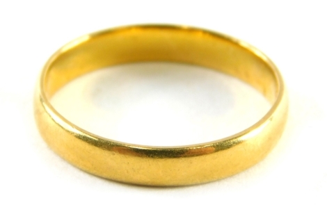 A 22ct gold wedding band, of plain design, ring size L, 2.4g.