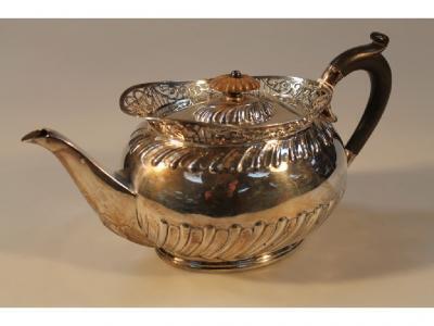 A George V silver oval tea pot by Roberts & Beth