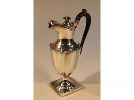 An Edward VII silver hot water jug by Thomas Bradbury & Sons