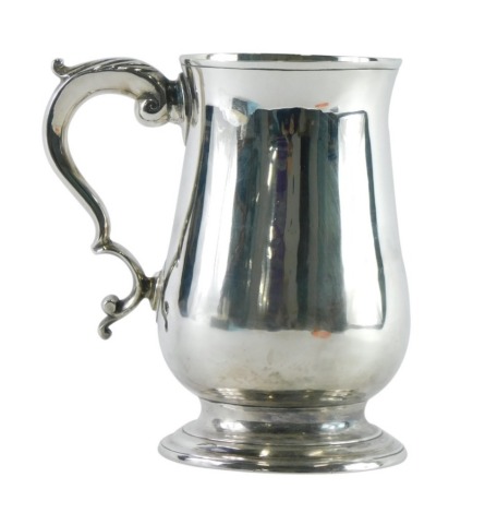 A George III silver mug, by Peter and Ann Bateman, acanthus leaf handle, plain body and circular foot, London, 1810, 13cm high, 8.8oz.