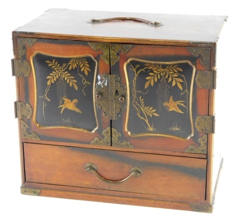 An Eastern jewellery box and contents, comprising mother of pearl type brooch, collar clips, badges, faux pearl necklaces, bar brooches, etc., all enclosed an oriental cabinet, 21cm high, 24cm wide, 14cm deep.