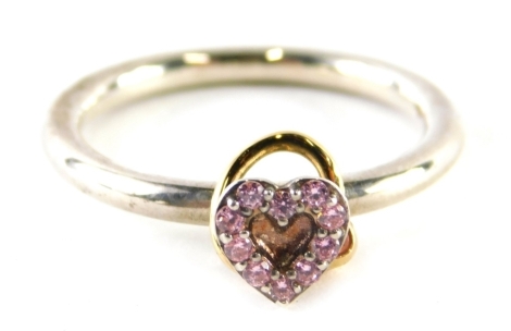 A Pandora dress ring, with central heart and gold loop, set with pink topaz, stamped 925 ale, ring size S, boxed, 4.4g.