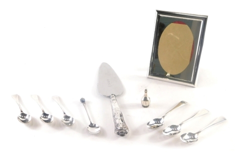 A set of six George V silver teaspoons, Old English pattern, Birmingham 1912, 10cm long, 2.75oz, a silver handled cake slice, plated photograph frame, etc. (a quantity)