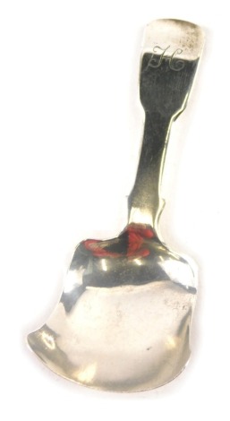 A George IV silver caddy spoon, Fiddle pattern, Birmingham 1827, initialled, 8cm long.