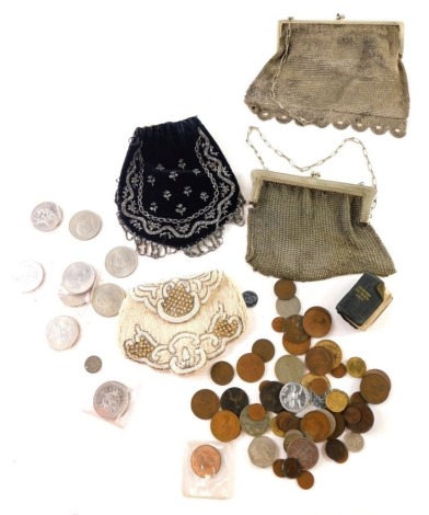 An mid 20thC silver plated chain mail evening purse, with orb clasps, 15cm wide, another similar, two beadwork evening bags, thumb dictionary, and a quantity of various coins, low denomination. (a quantity)