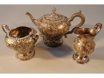 An early George V silver three piece tea service
