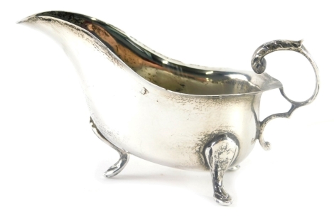 An Elizabeth II silver sauce boat, with S scroll acanthus leaf handle, flared rim and triple hoof feet, Birmingham 1967, 9cm high, 2.7oz.