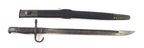 An early 20thC bayonet with leather and metal scabbard, plain blade marked with crescent, wooden handle and compressed hilt, 57cm long.