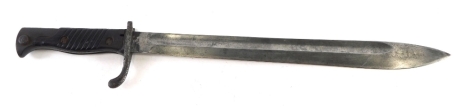 An early 20thC Schulfe and Co bayonet, with shaped blade and turned handle, 28cm long.