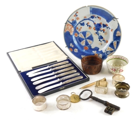 Various silver china and effects, silver napkin rings, an unusual Roman type attic style bowl, early 19thC pearlware tea bowl, Japanese Imari plate, silver napkin rings, cased silver handled knives, etc. (a quantity)