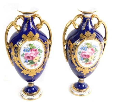 A pair of 20thC Royal Crown Derby vases, by Charles Harris, with compressed trumpet stems, oval hand painted sections of summer flowers, gilt highlights on inverted stem and circular foot, each flanked by gilt handles, numbered 68541296M/S, with red print