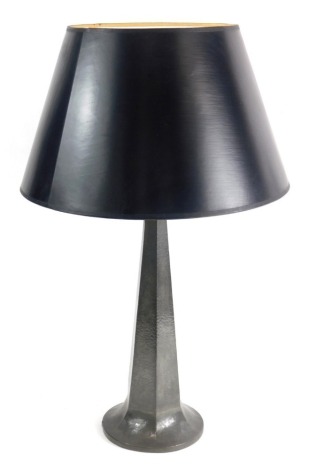 An early 20thC Homeland pewter table lamp, with later shade, the tapering hammered body numbered 513 to the underside, 53cm high.