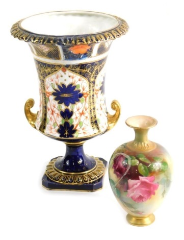 A Royal Crown Derby Imari urn vase, on canted base, 23cm high, and a circa 1900 Royal Worcester vase, hand painted with flowers. (2, each AF).