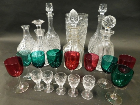 Various cut glass crystal glassware, etc., a 20thC vase of tapering circular form with a hobnail cut decoration, 27cm high, various decanters, mallet shaped, etc., a quantity of cranberry and green glass wine glasses, etc. (a quantity)