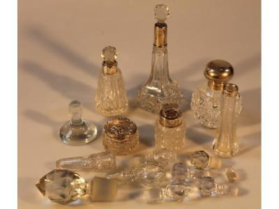 A group of six early 20thC cut glass scent bottles and similar