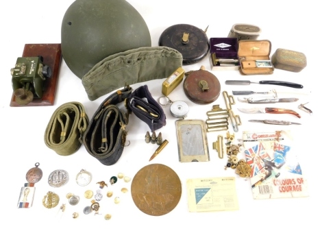 Various army related items, WWII etc, a helmet numbered 8974, other apparatus, part Sam Browne style belts, Commando War Stories ephemera, a Morse code machine with crow's foot mark stamped JBU, 24cm wide etc (a quantity)