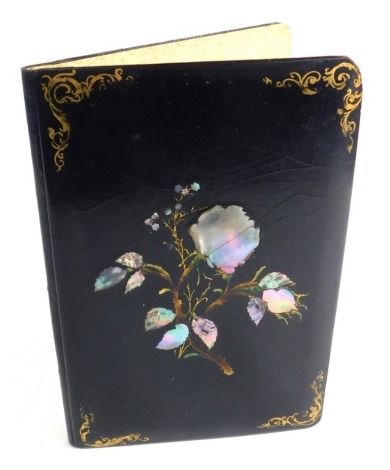 A Victorian ebonised and mother of pearl blotter, the exterior decorated with mother of pearl highlighted flower with gilt spandrels, 23cm x 16cm.