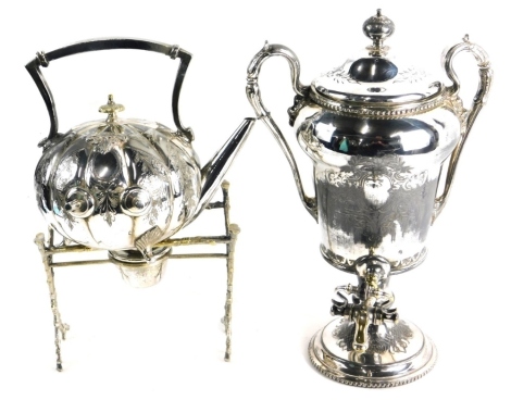 An early 20thC tea urn, with domed lid flanked by fluted ear shaped handles, with front brass tap, on circular foot, 36cm high, and a spirit burning kettle. (2)