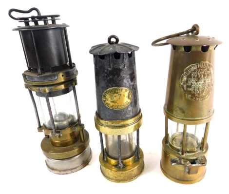 Three various miner's lamps, Conset Iron Co. No. 57, 26cm high, etc. and two others. (3)