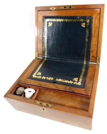 A late 19thC walnut domed top writing slope, with gilt tooled writing section, space for ink bottles and pens, with elaborate interior and escutcheon, 15cm high, 27cm wide, 20cm deep.