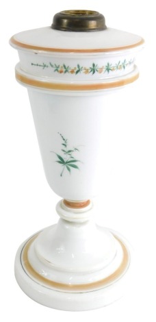 A Victorian milk glass lamp base, of tapering circular form, hand painted with flowers, on a circular foot, 35cm high.